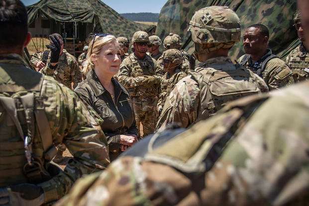 Christine Wormuth, U.S. Secretary of the Army, center, recognizes 4th Infantry Division soldiers