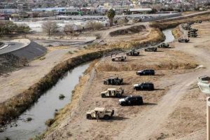Texas National Guard members and DPS officers along the Rio Grande