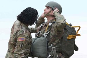 Female paratrooper prepares for a jump