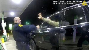 police officer uses a spray agent on Caron Nazario