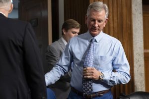Sen. Tommy Tuberville arrives for a Senate Armed Services Committee hearing