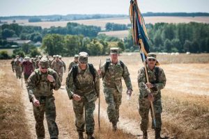 Members of the Alabama Army National Guard carry their organizational colors