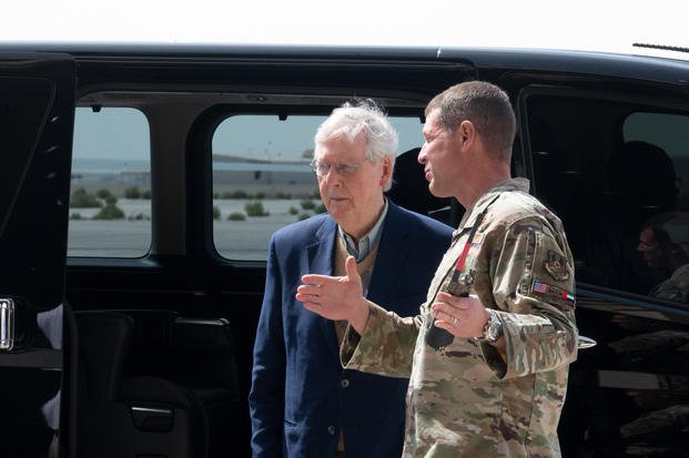 U.S. Air Force Brig. Gen. David R. Lopez, commander of the 380th Air Expeditionary Wing, welcomes U.S. Senate Minority Leader Mitch McConnell, R-Ky., to Al Dhafra Air Base, United Arab Emirates.