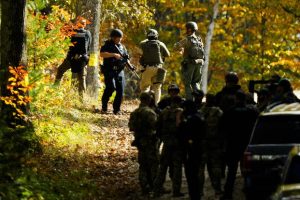 Law enforcement continue a manhunt in the aftermath of a mass shooting.