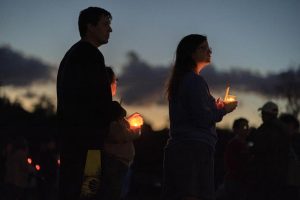 Mourners attend a candlelight vigil in Lisbon Falls, Maine, for the victims of the mass shootings in nearby Lewiston.