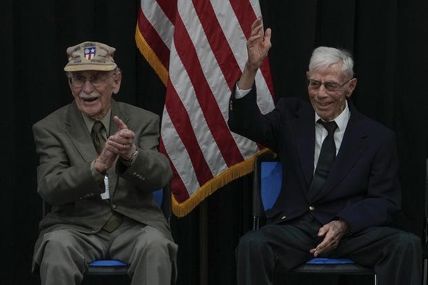 US World War II veterans Harry Moyer, right, gestures next to his compatriot Mel McMullen