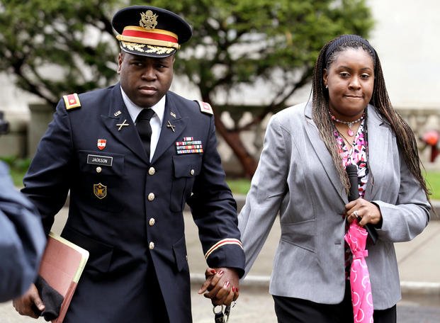 John Jackson, left, and his wife, Carolyn Jackson, of Mount Holly, N.J., walk out of a courthouse