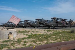 U.S. Army AH-64 Apaches sit on the flight line at Ali Al Salem Air Base, Kuwait.
