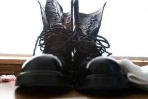 Jump boots belonging to Sgt. Stanley Garrastazu, a satellite operator and maintenance specialist assigned to the 4th Joint Support Command, 335th Signal, dry after being polished at Fort McCoy, Wis.