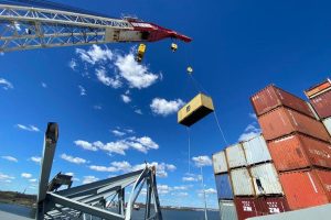 Response crews began removing shipping containers using a floating crane barge at the site of the Francis Scott Key Bridge