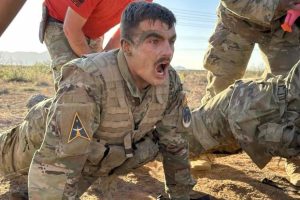 1st Lt. Jordan Savage does pushups in the West Texas desert