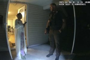 In this image taken from body camera video released by Illinois State Police, Sonya Massey, left, talks with former Sangamon County Sheriff’s Deputy Sean Grayson outside her home in Springfield, Ill.