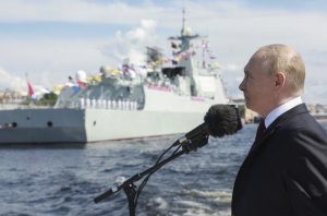 Russian President Vladimir Putin greets sailors