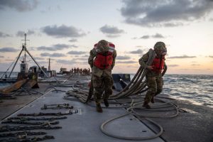 Soldiers transport the Trident Pier across the Mediterranean Sea