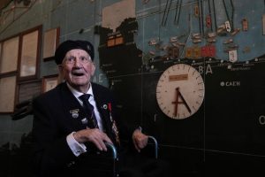 British Normandy campaign veteran George Chandler of the Royal Navy speaks to the media