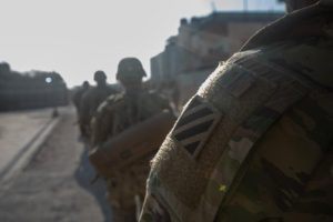 U.S. Army soldiers  conduct a tactical movement in Northeast Syria