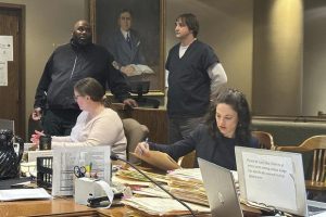 Karl P. Loucks, standing, right, listens to a judge during his court hearing in Memphis, Tennessee