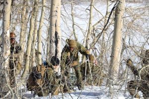 Marines hike during mountain training exercise