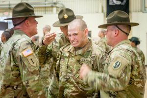 Drill sergeants welcome a new soldier to Fort Leonard Wood