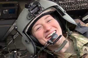 Capt. Rebecca Lobach smiles in the cockpit of a UH-60 Black Hawk helicopter on Feb. 28, 2024. (Photo courtesy of Samantha Brown)