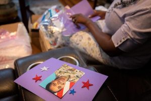 Oneida Oliver-Sanders, mother of Army Reserve Sgt. Kennedy L. Sanders, makes Memorial Day craft packages for elementary school students at her home in Waycross, Georgia.