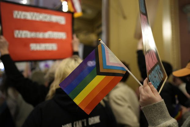 Protesters denounce a bill that would strip transgender rights in Iowa