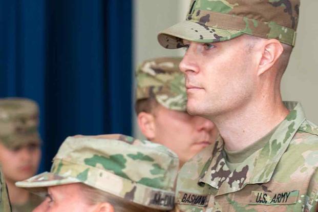 mil-mark-bashaw-ceremony-1800.jpg 1st Lt. Mark Bashaw looks on during a change of command ceremony