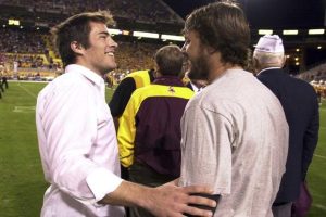 Richard Tillman, left, the brother of former Arizona State player Pat Tillman, greets one of his brother's former teammates, Jake Plummer, right, prior to a ceremony retiring Pat's jersey during halftime of the Washington State-Arizona State game, Nov. 13, 2004, in Tempe, Ariz.