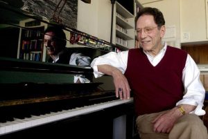 Musician Tom Lehrer sits beside the piano in his house in Santa Cruz, Calif.