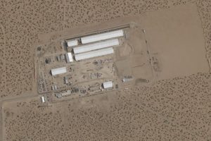 construction of large white tents for a new immigrant detention center at Fort Bliss
