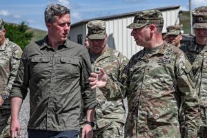 Secretary of the Army Dan Driscoll speaks with Brig. Gen. Patrick M. Costello