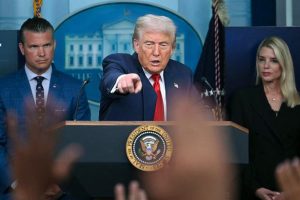 U.S. President Donald Trump takes questions from reporters
