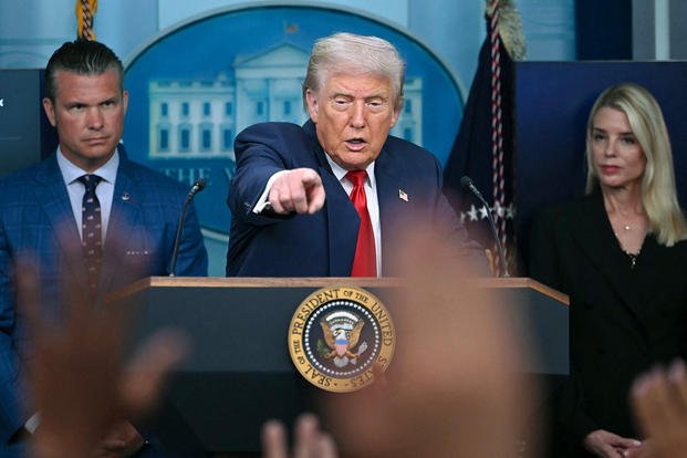 U.S. President Donald Trump takes questions from reporters