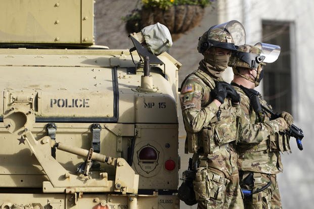 Members of the Georgia National Guard stand guard