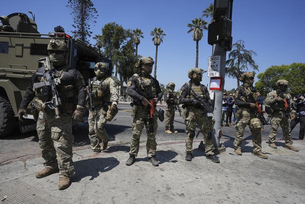 Federal agents stage at MacArthur Park in Los Angeles.