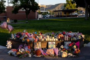 Pictures, flowers and candles mark a makeshift memorial in honor of the Decker sisters on Tuesday, June 3, 2025, in Wenatchee. (Nick Wagner/The Seattle Times/TNS)