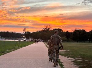 National Guard troops patrol the National Monument in Washington, D.C., as their deployment is extended through November. Photo by Bridget Craig