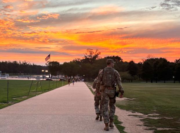 2.png.jpg National Guard troops patrol the National Monument in Washington, D.C., as their deployment is extended through November. Photo by Bridget Craig